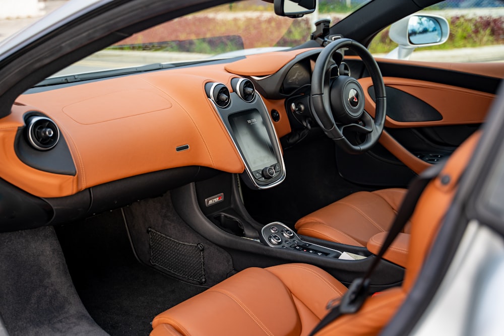 black and orange car steering wheel