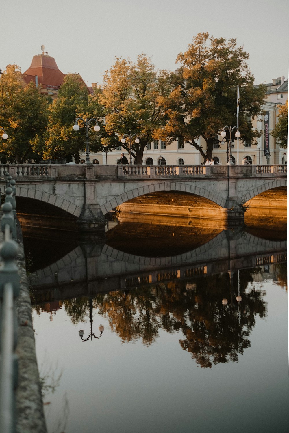 brown wooden bridge over river