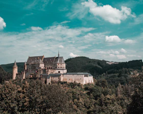 A breathtaking medieval castle surrounded by dense forests in Minecraft.