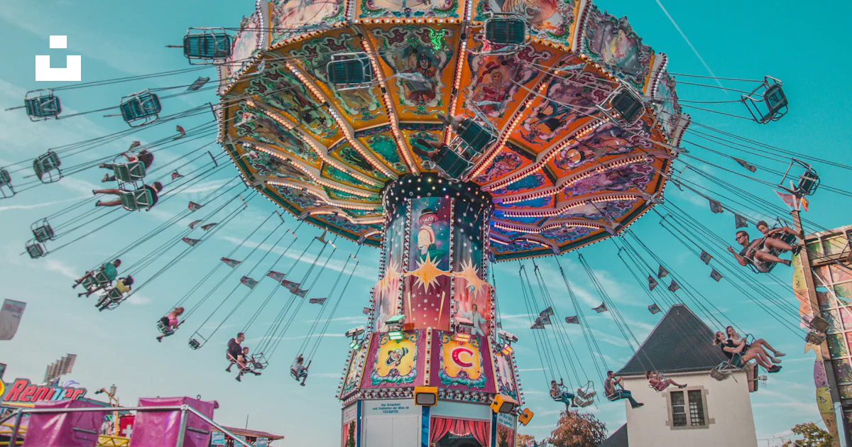 Carrousel Rides Red People riding on yellow and red carousel during daytime photo – Free ...