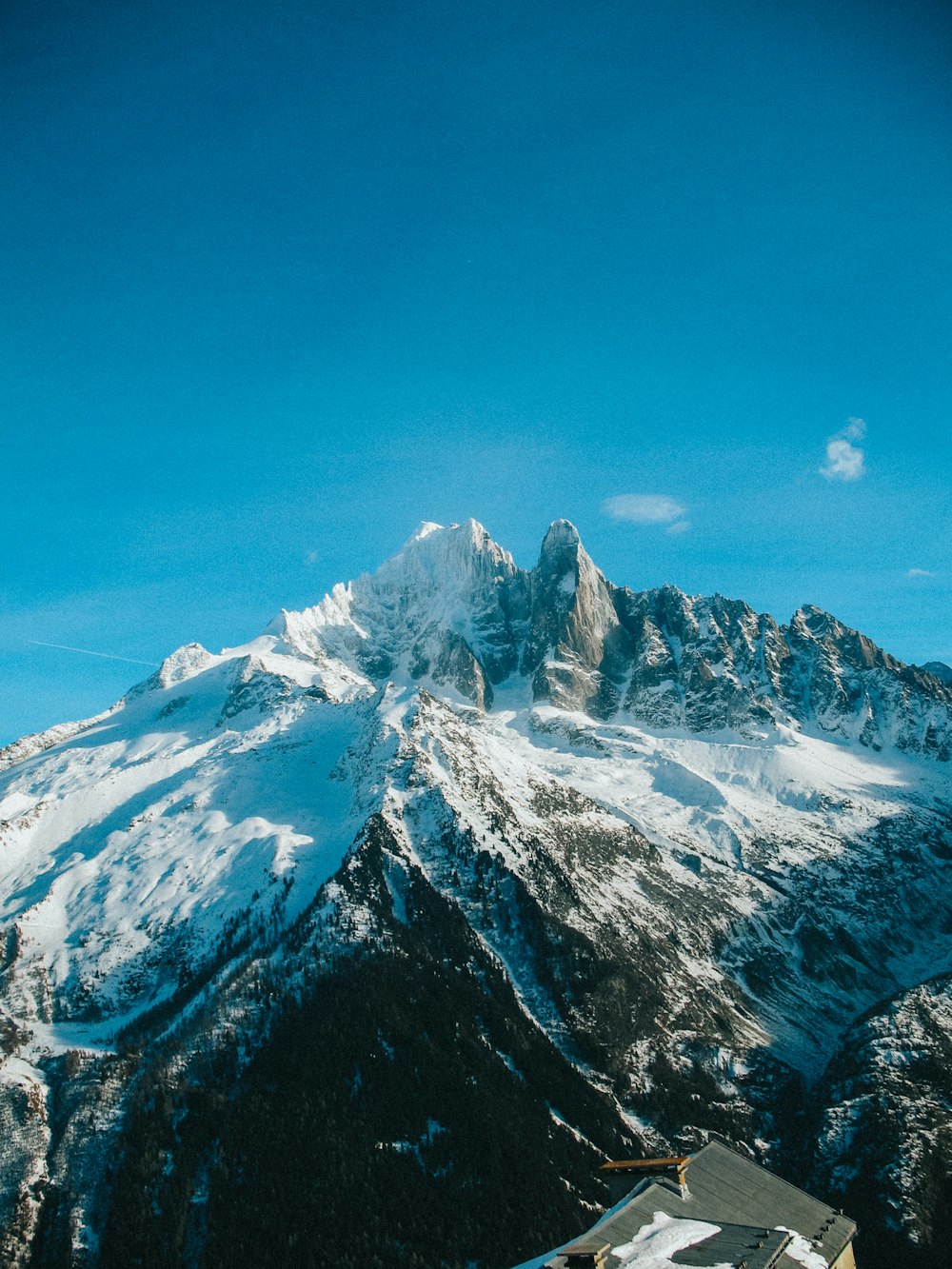 snow covered mountain under blue sky during daytime