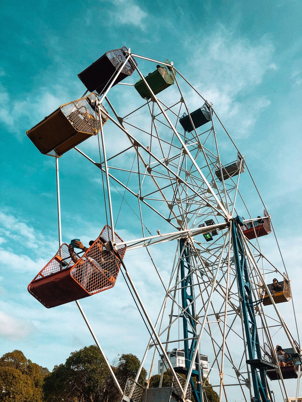 white and brown ferris wheel under blue sky during daytime