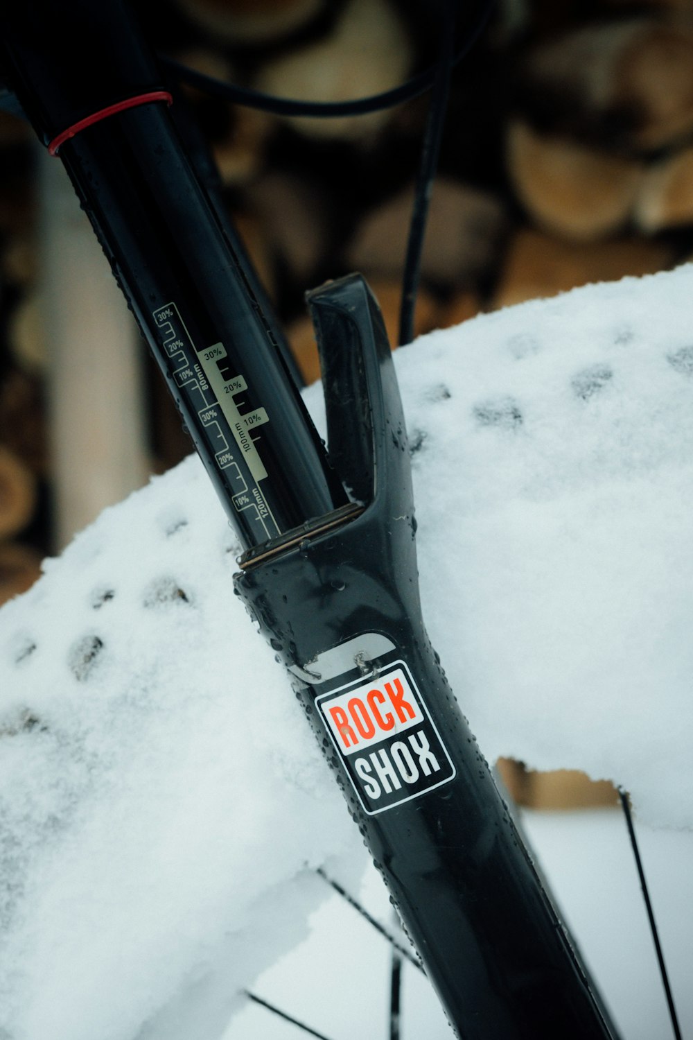 a close up of a bike with snow on it