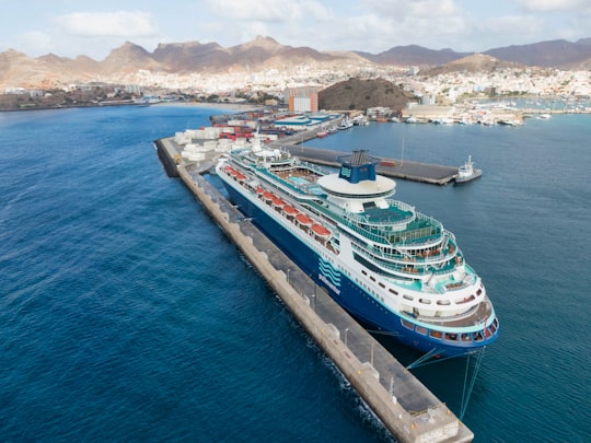 white and blue cruise ship on sea during daytime in Mindelo Cape Verde