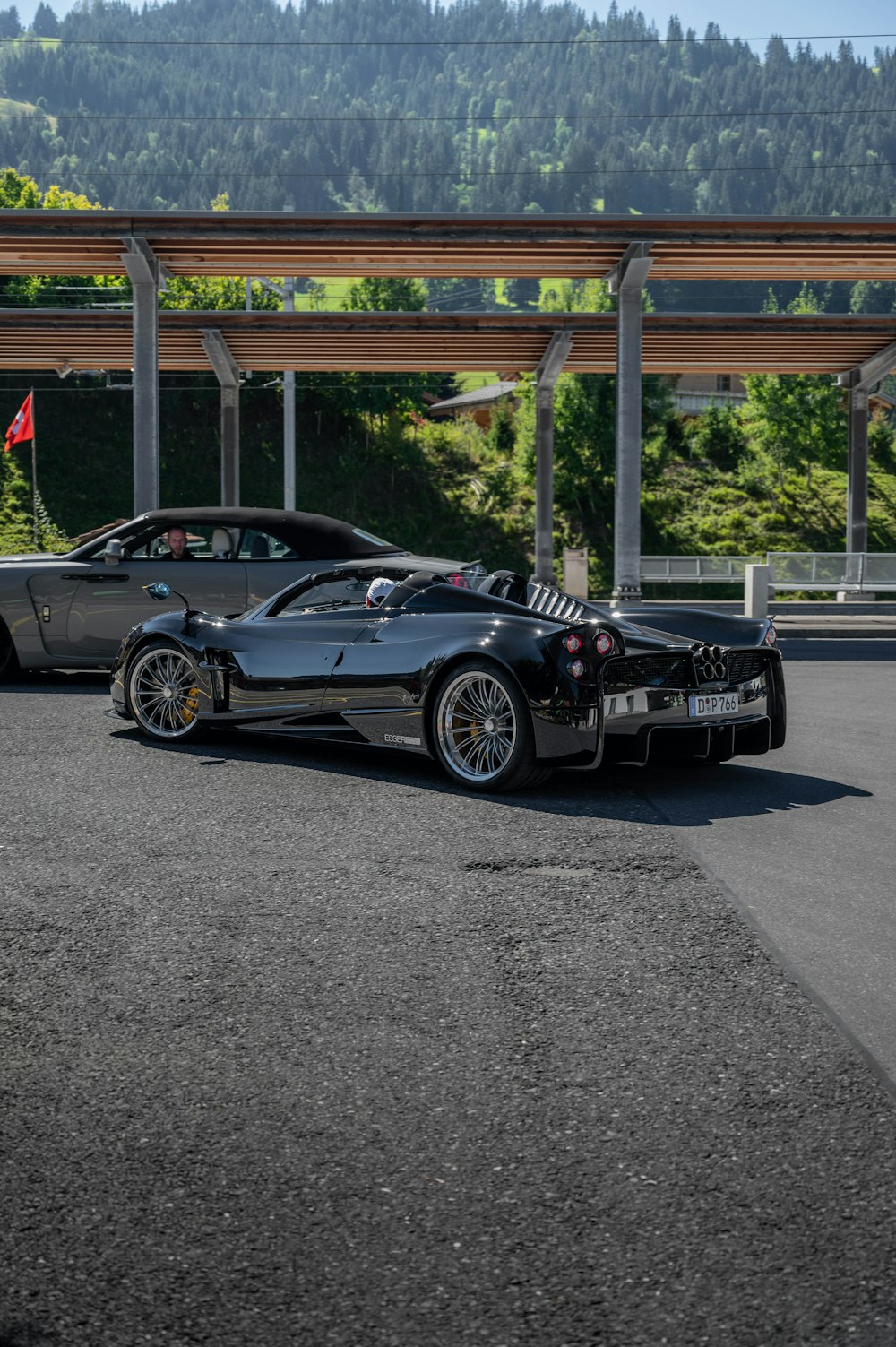 black porsche 911 parked on parking lot during daytime