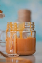 clear glass jar with brown liquid