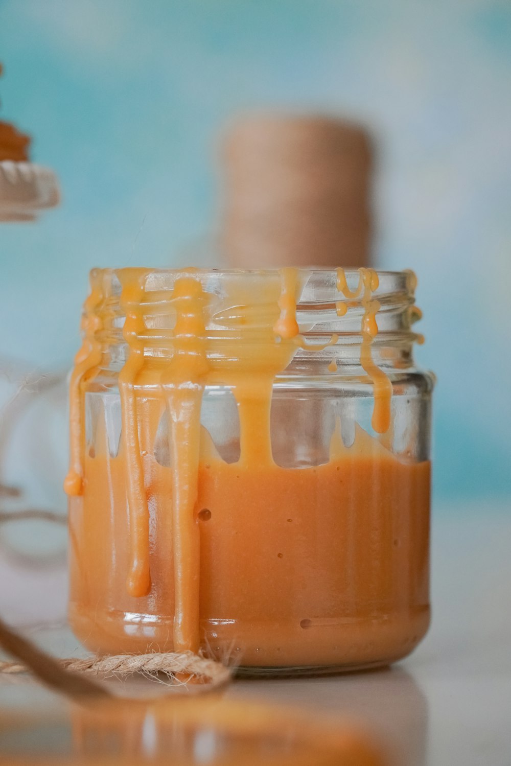 clear glass jar with brown liquid