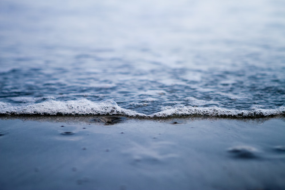 water waves on shore during daytime