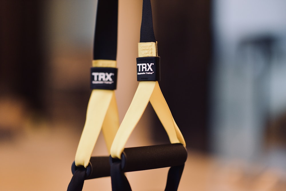 black and yellow strap on brown wooden table