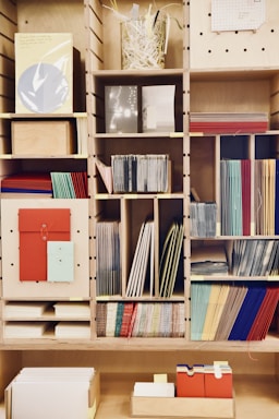 books on brown wooden shelf