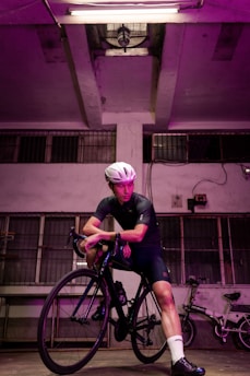 Cyclist adjusting a high-quality bike helmet in a cozy shop setting