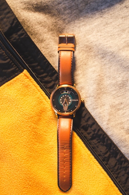 black leather strap silver round analog watch