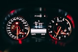 black and red analog speedometer