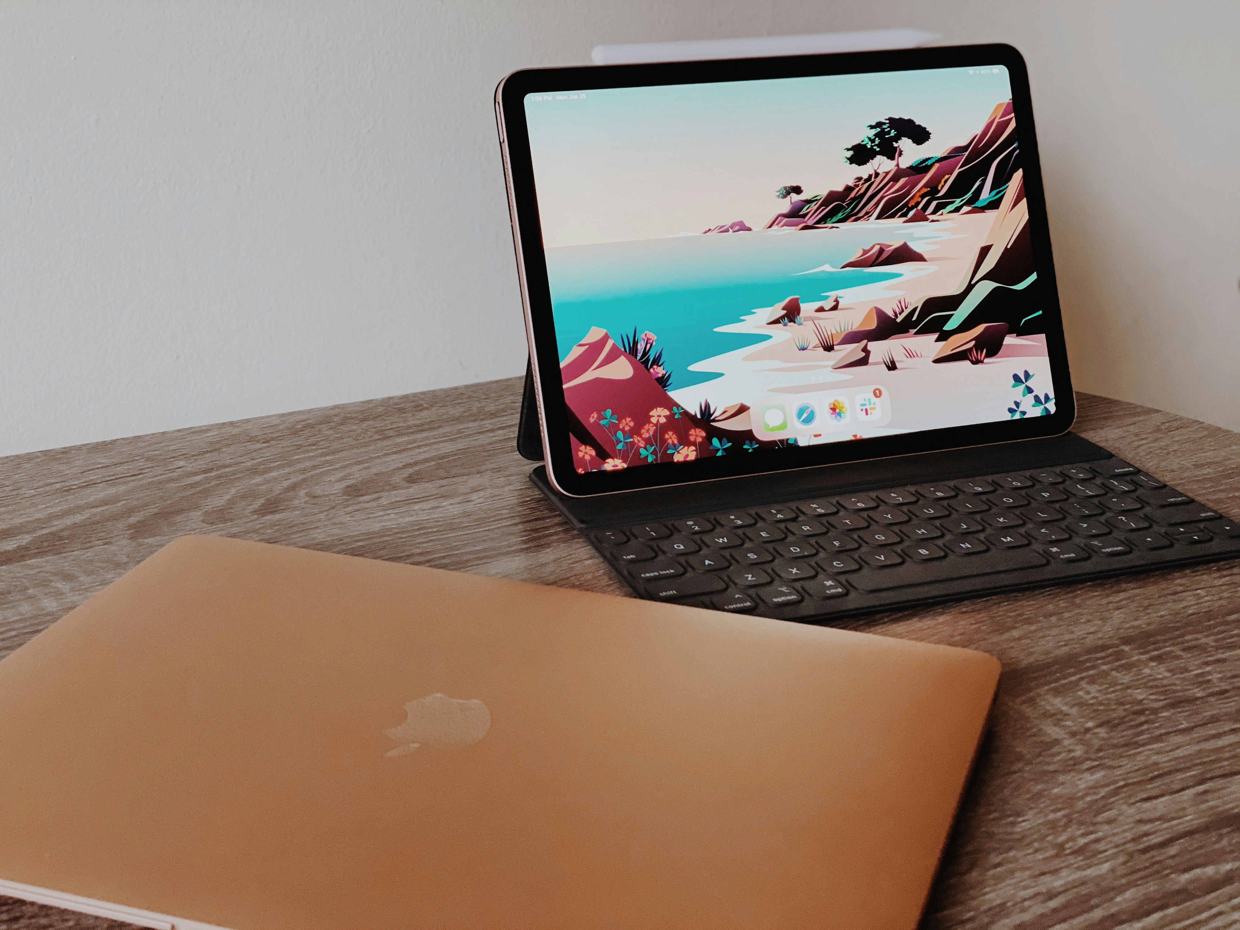 Pad Air with keyboard and closed MacBook Air