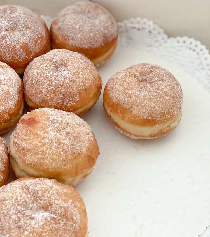 Jam berliners (jam-filled donuts with no centre hole, coated in sugar).