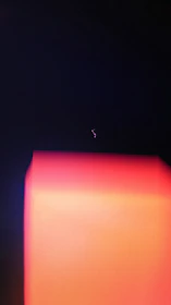 Interactive category icons glowing in burnt-orange against a bold dark background.