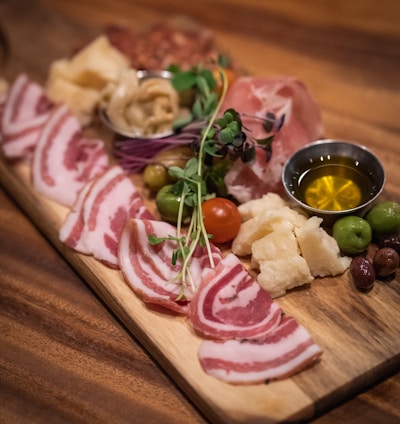 raw meat on brown wooden chopping board