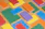 Close-up of colorful notebooks and pens arranged neatly on a desk