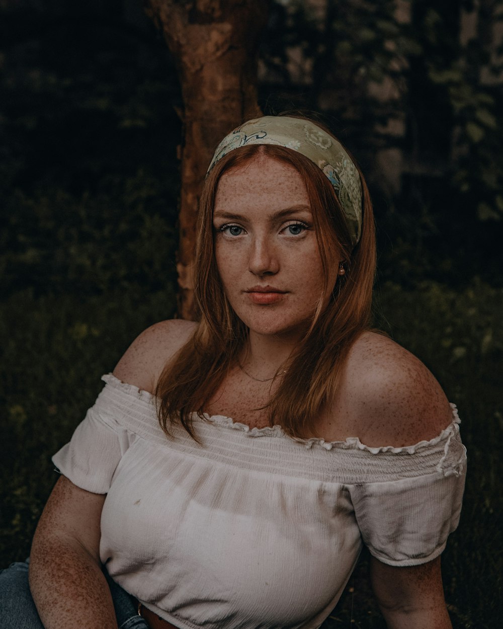 woman in white dress wearing brown hat