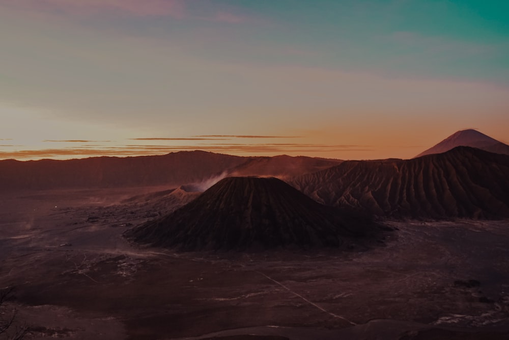 brown and black mountain under white sky during daytime