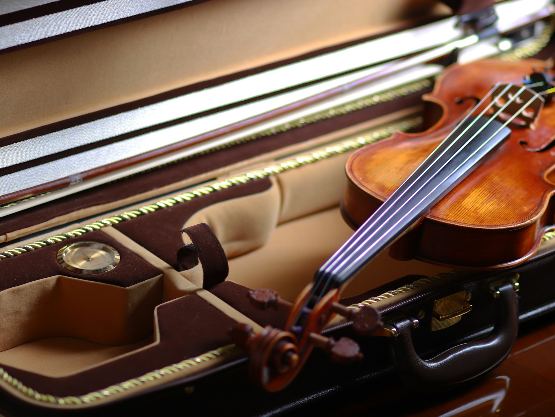 brown violin on white textile