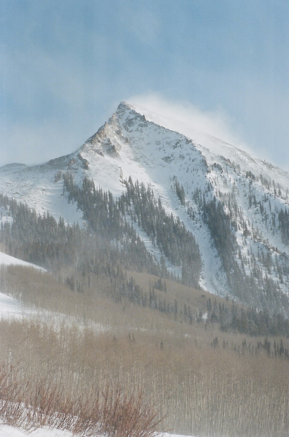 snow covered mountain during daytime