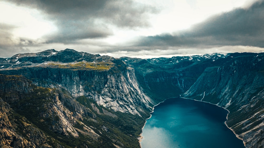 aerial view of lake between mountains