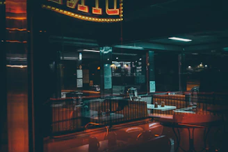 Cozy, dimly lit interior of a tucked-away Long Beach diner with a signature dish on the table.
