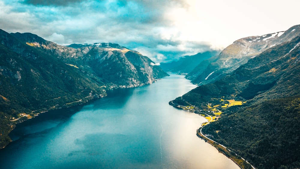 aerial view of lake between mountains during daytime