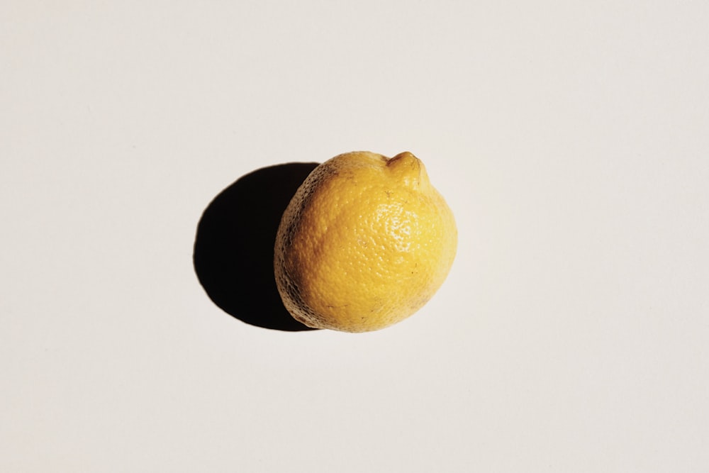 yellow lemon fruit on white table