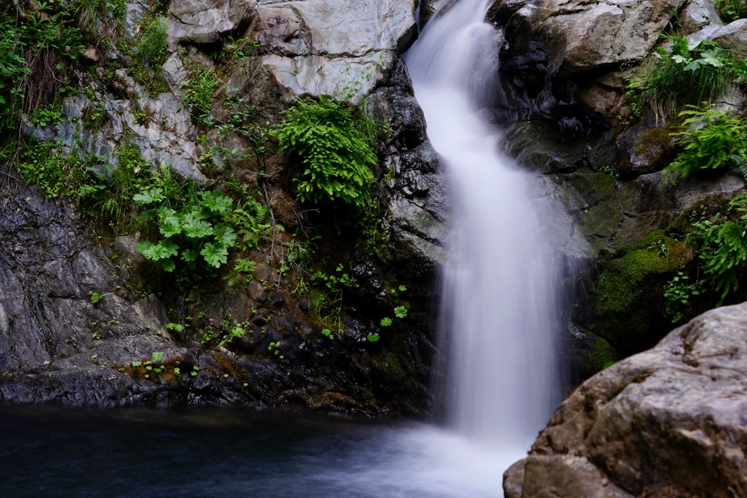 water falls on rocky mountain