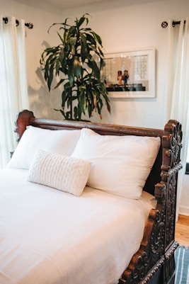 white bed pillow on bed
