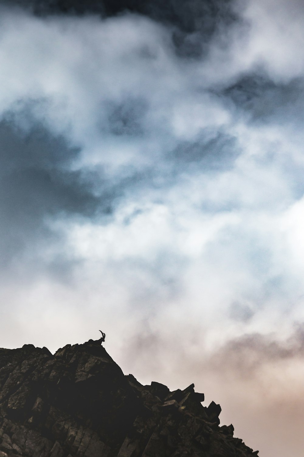 gray clouds over brown mountain