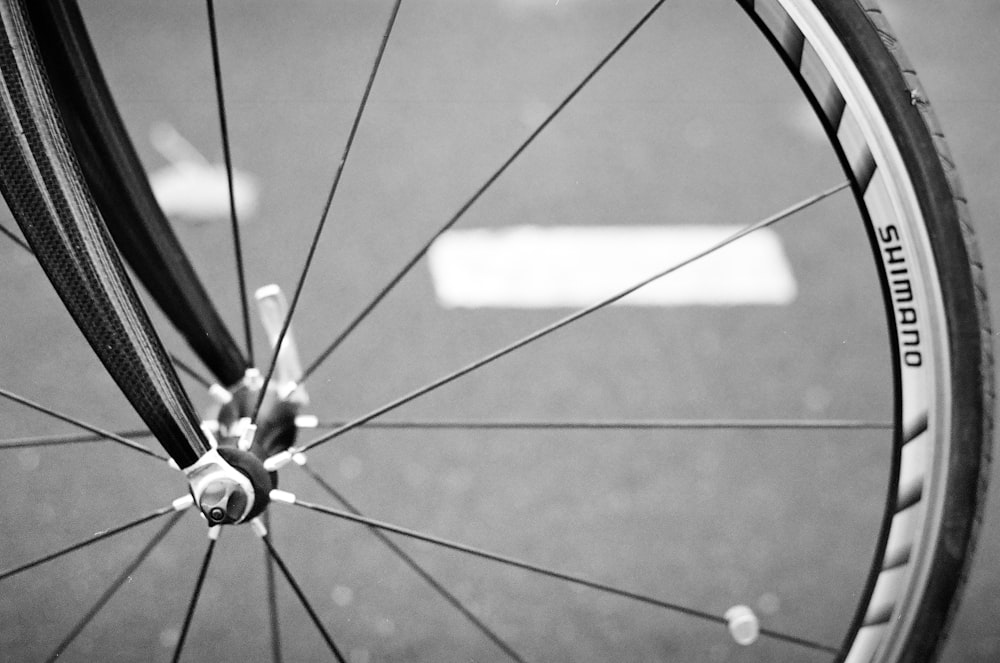 black bicycle wheel in close up photography