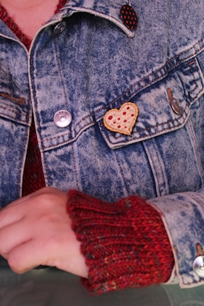 person in blue denim button up jacket