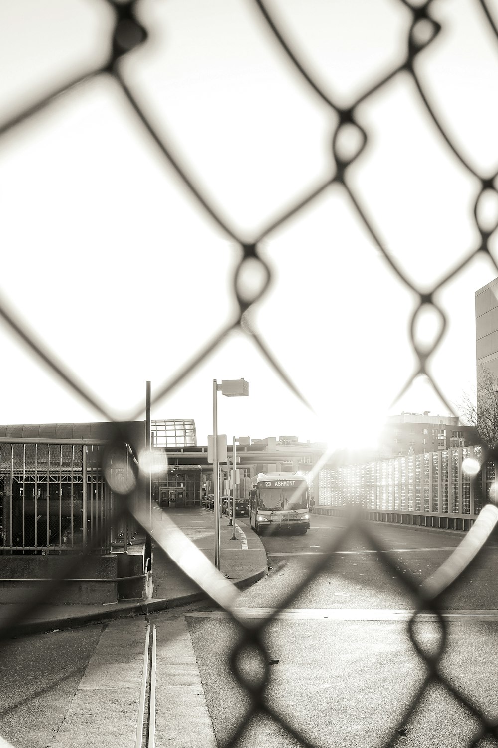 grey metal fence near road during daytime