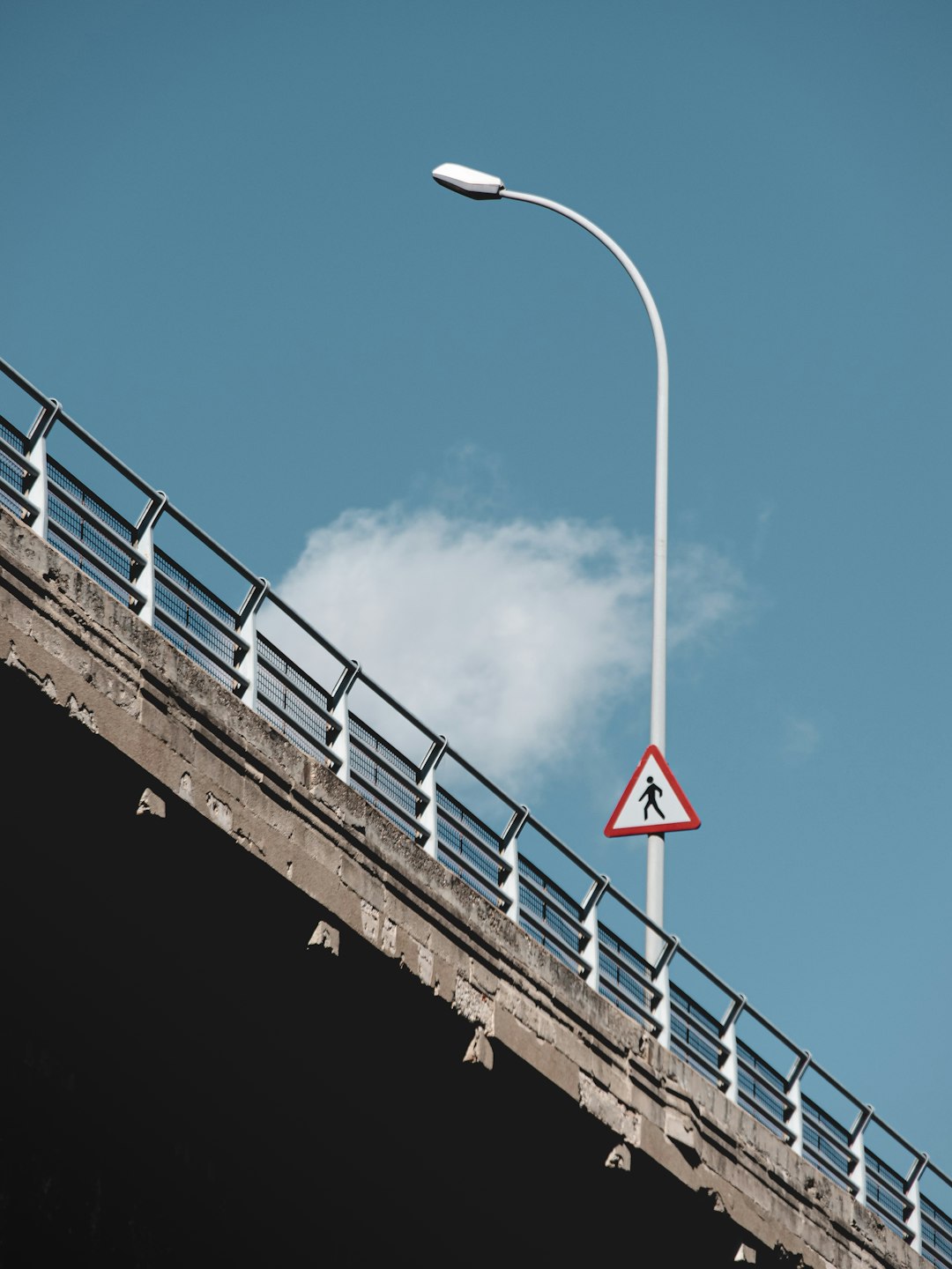 white and red bridge under blue sky during daytime