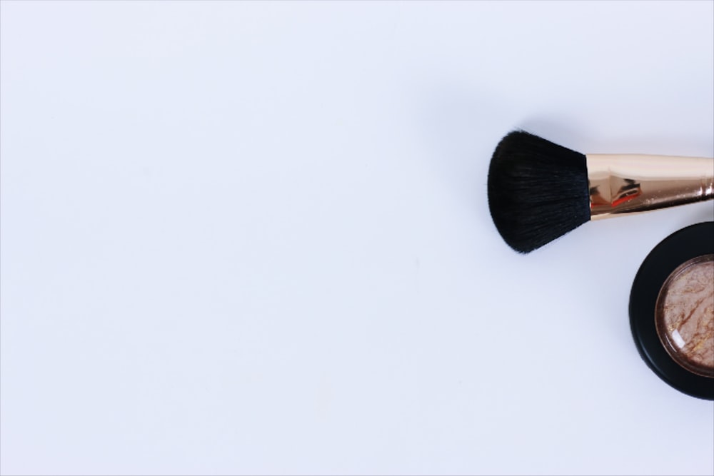 black brush on white surface