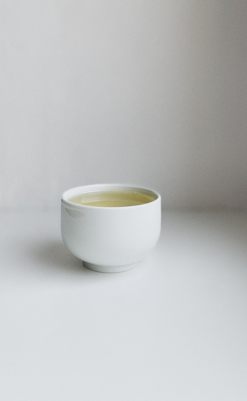 A bowl of rich homemade bone broth with herbs — a nutritious drink for seniors supporting joint and gut health
