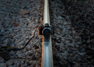 Stereo camera mounted on a railway vehicle capturing spatial data in foggy conditions.
