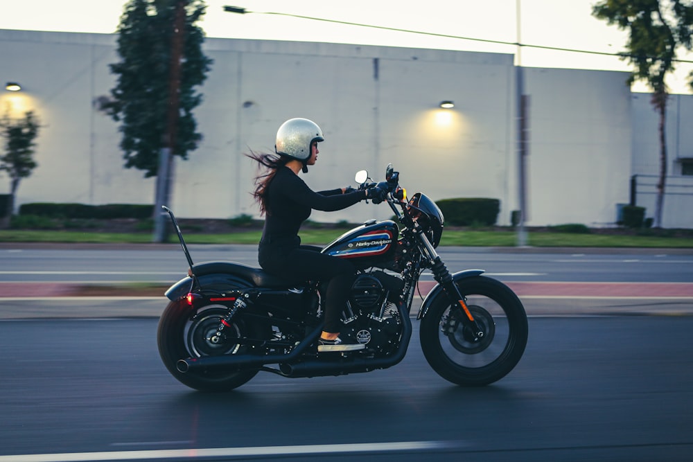 man in black jacket riding black motorcycle