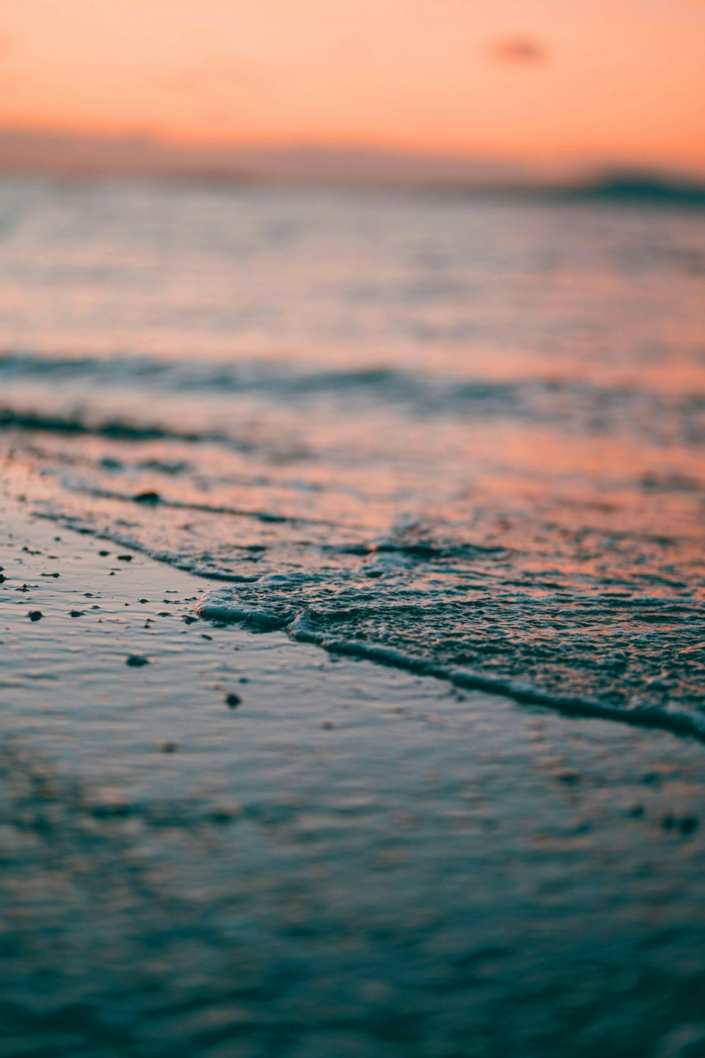 water droplets on brown sand