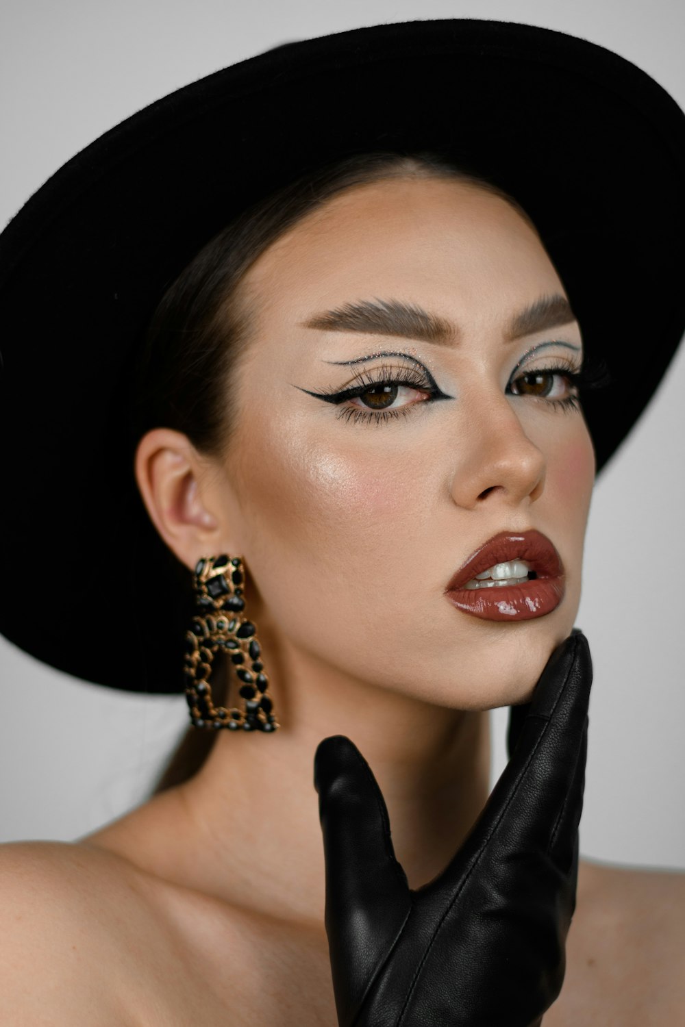 woman wearing black hat and gold ring