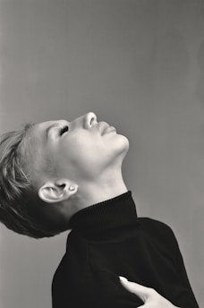 grayscale photo of woman in black sweater