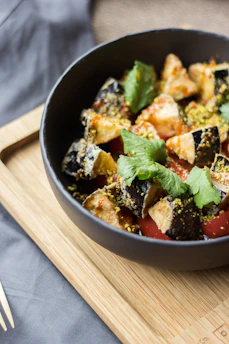 cooked food on black ceramic bowl