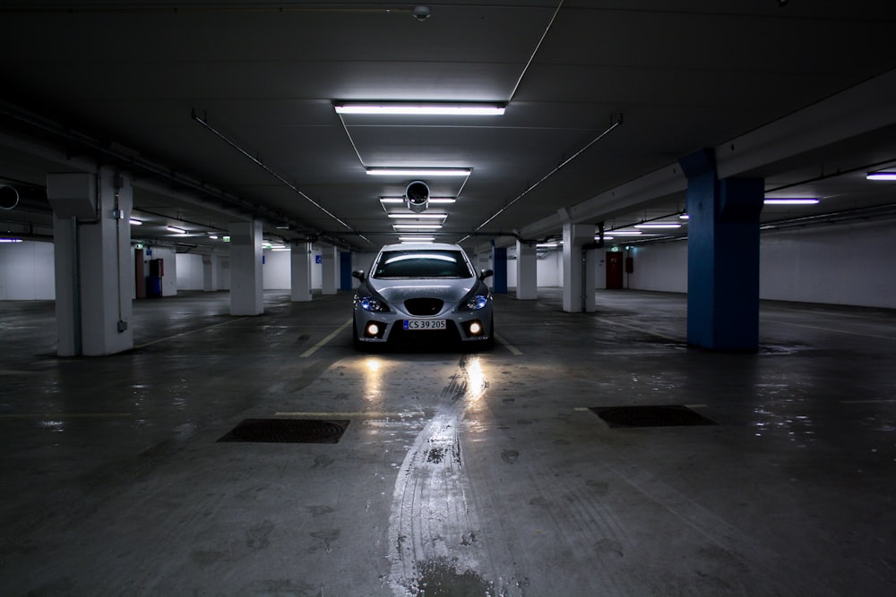 white and black car in a parking lot