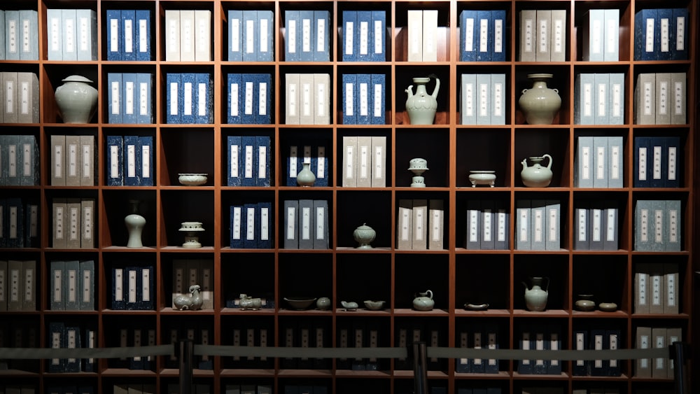 books on brown wooden shelf