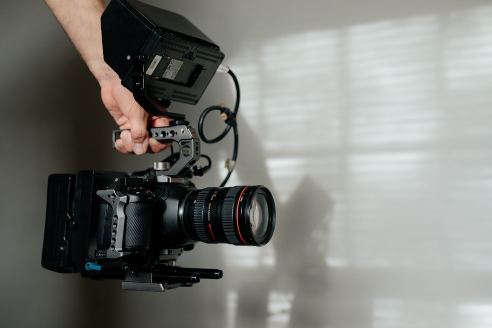 black dslr camera on white table