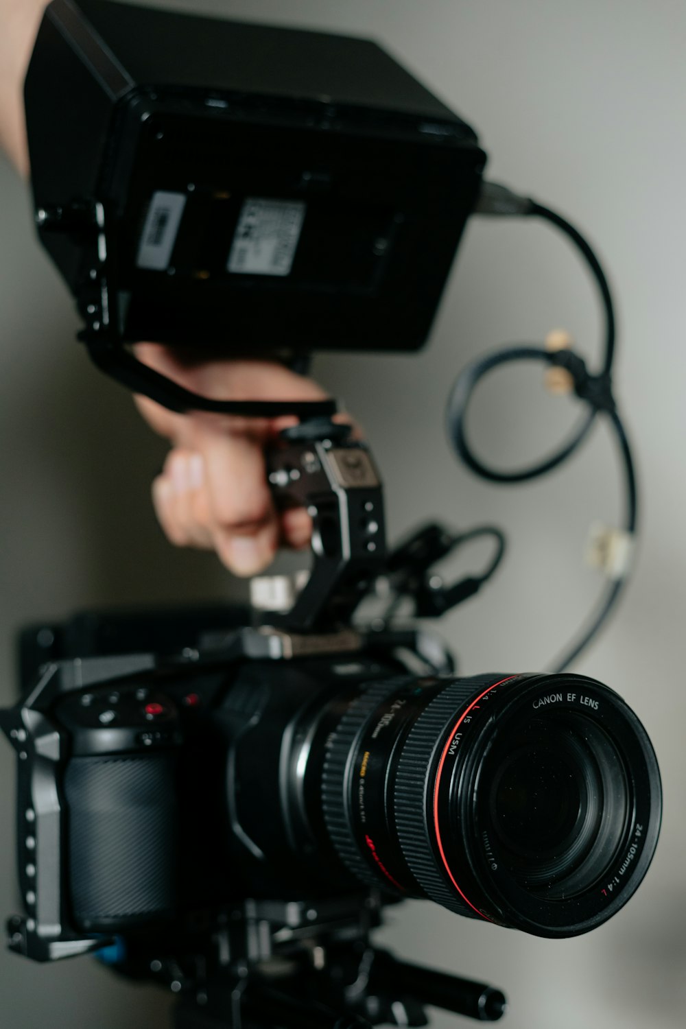 person holding black dslr camera