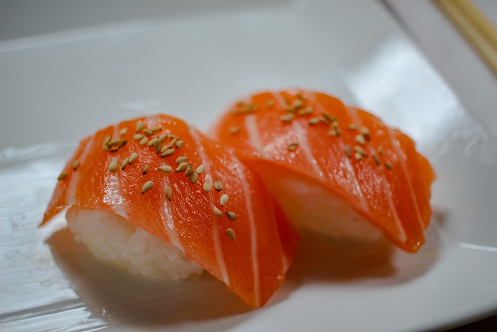 sliced orange fruit on white ceramic plate